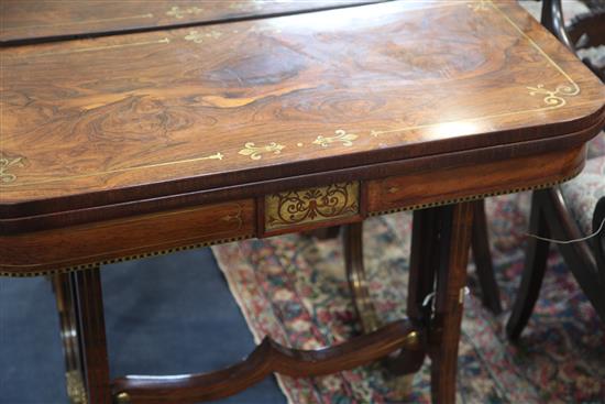 A pair of Regency brass inset rosewood card tables, W.2ft 11in. D.1ft 5.5in. H.2ft 5in.